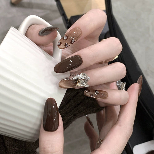 Luxury artificial nails with elegant rhinestone applications Bowlift