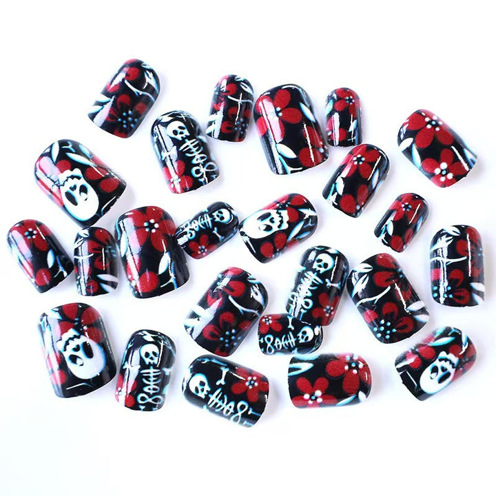 Artificial nail set with creepy skull design and floral accents Bowlift
