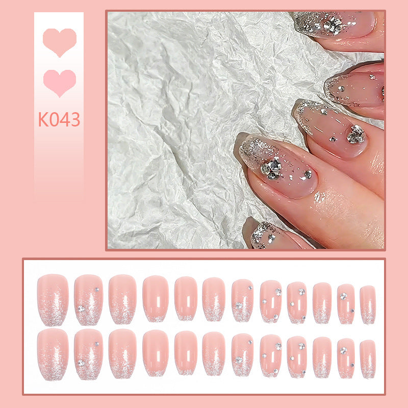 Acrylic nail set with extravagant glitter and crystal embellishments Bowlift