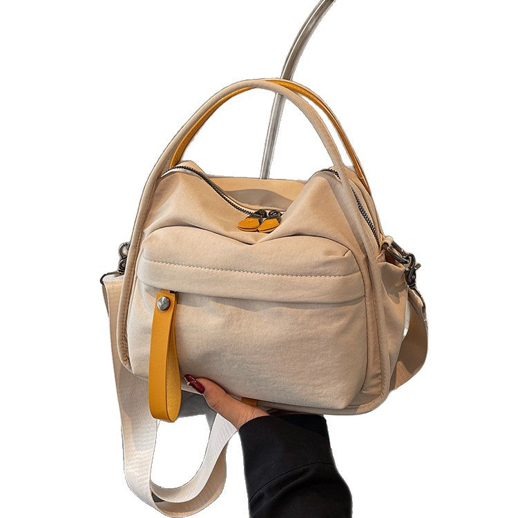 Fashionable shoulder bag with innovative structure and detachable carrying strap Bowlift