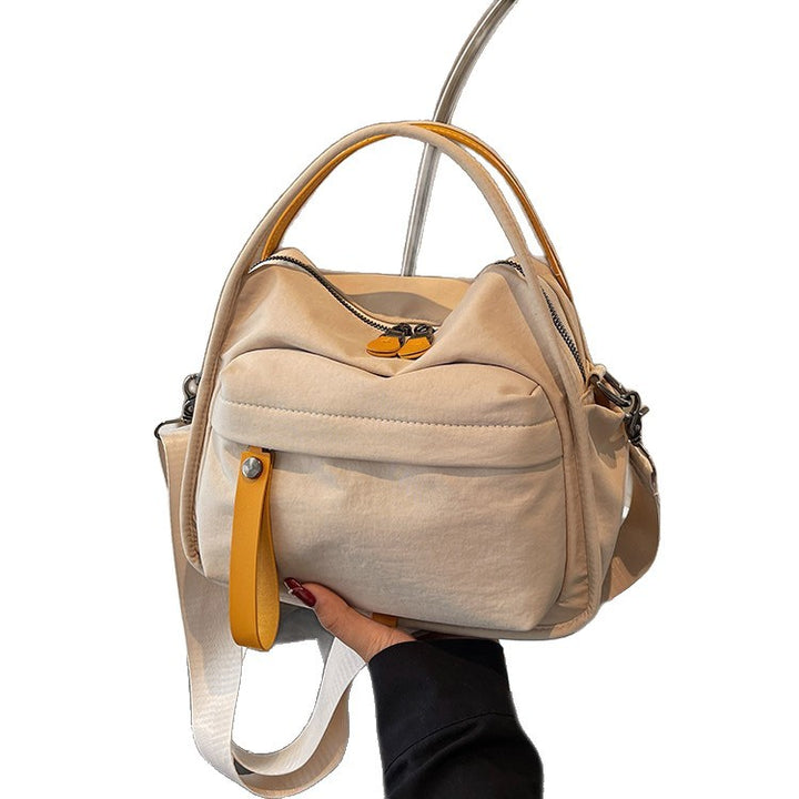 Fashionable shoulder bag with innovative structure and detachable carrying strap Bowlift