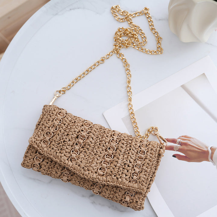 Clutch with chain shoulder strap and handcrafted macrame closure Bowlift