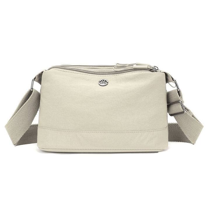 Shoulder bag with adjustable carrying strap and intelligent compartment system Bowlift