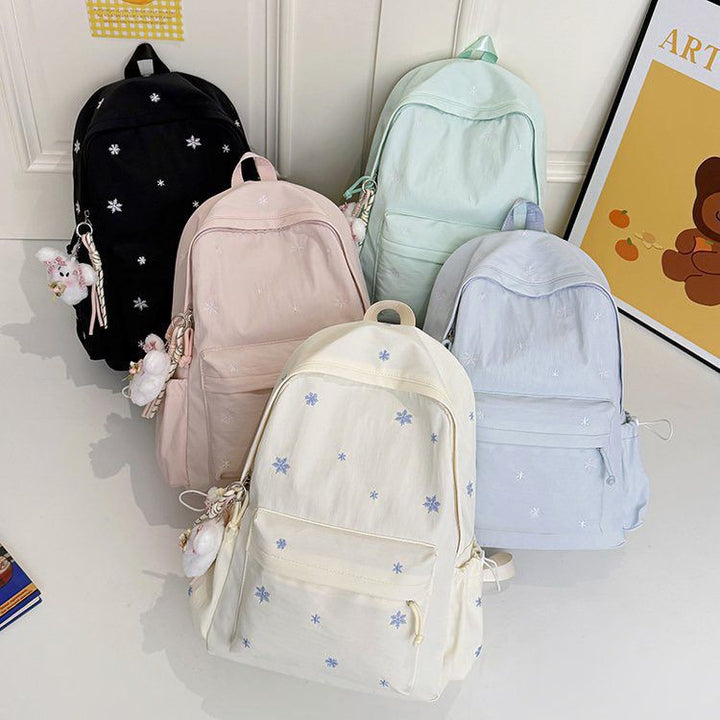 Playful backpack with fine embroidery Bowlift