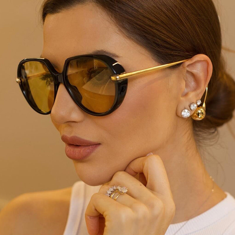 Women's Cat-Eye Sunglasses with Golden Accents and Stylish Frame Bowlift