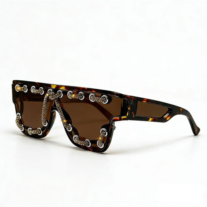 Ladies sunglasses with extravagant design and decorative chain embellishment Bowlift