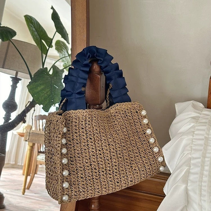 Fashionable straw bag with ruffle detail Bowlift