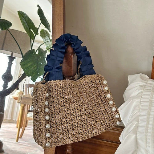 Fashionable straw bag with ruffle detail Bowlift