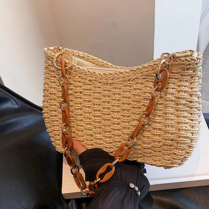 Handcrafted straw bag with golden chain details Bowlift