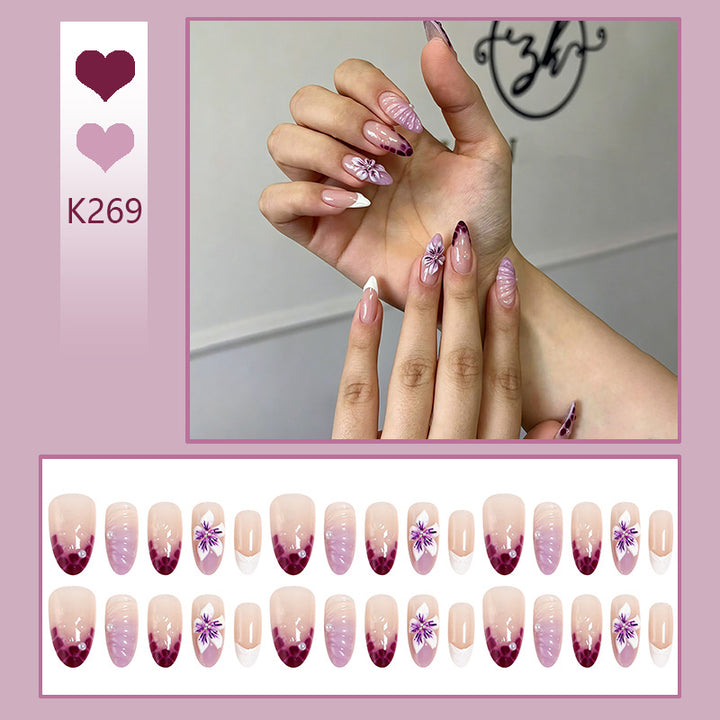 Artificial nail set with elegant ombre design and floral accents Bowlift
