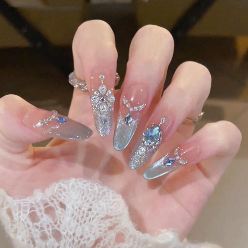 Glamorous artificial nails with sparkling rhinestone accents Bowlift