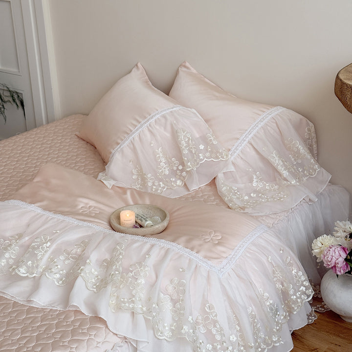 Satin bed linen set with embroidered chiffon ruffle and quilted bedspread