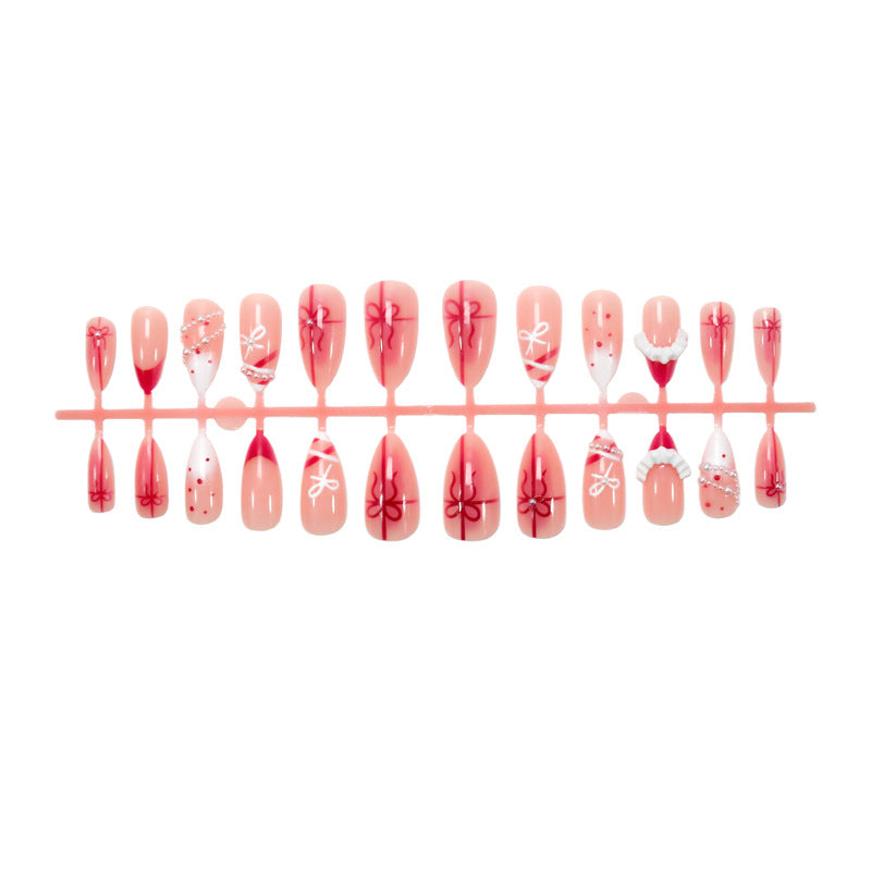 Nail set with glamorous bows and elegant pearl embellishments Bowlift