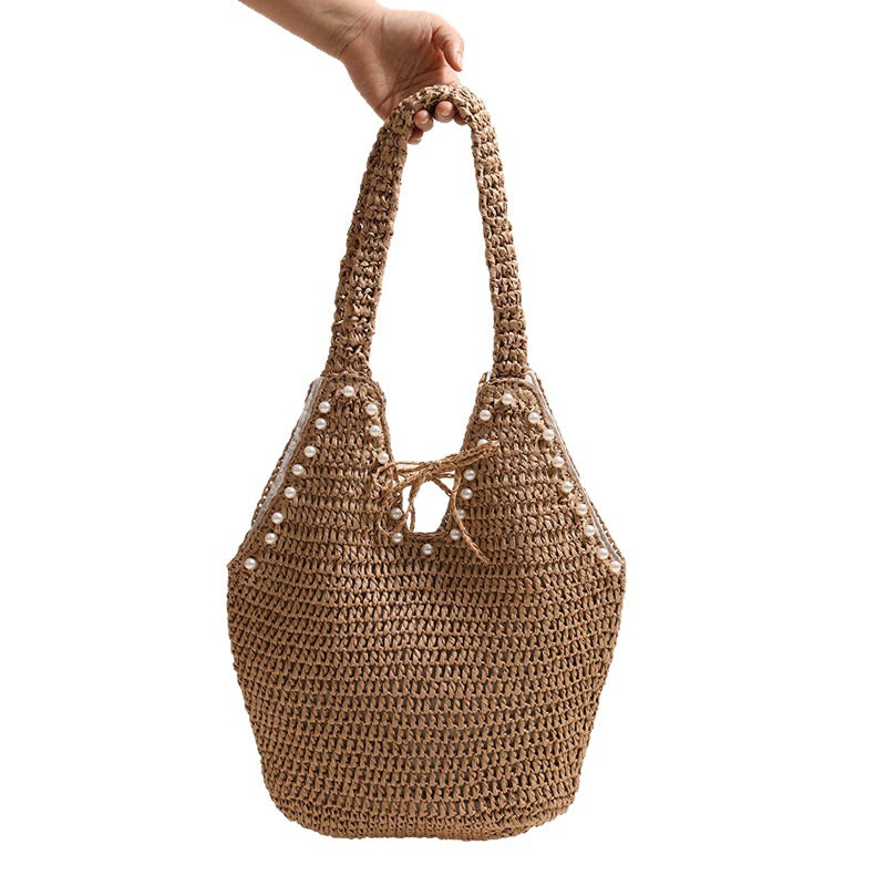 Handbag with pearl decor and innovative closure Bowlift