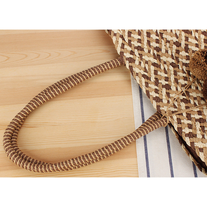 Summer wicker handbag with pom poms Bowlift