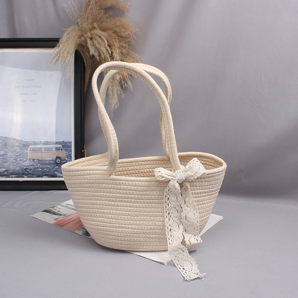 Basket bag with playful lace accent Bowlift