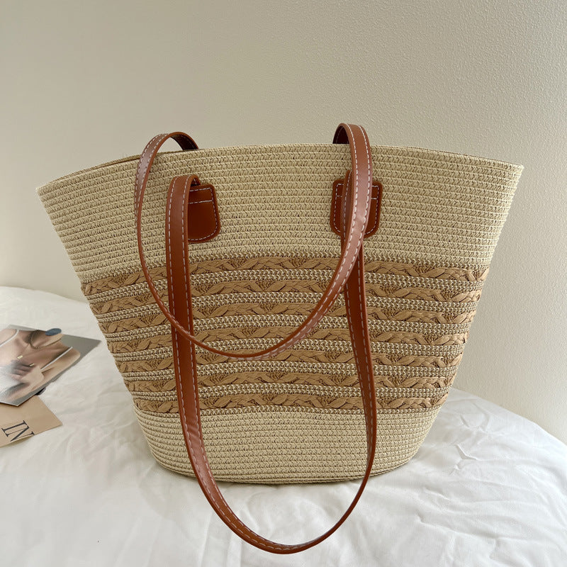 Handcrafted wicker bag with elegant leather accents Bowlift