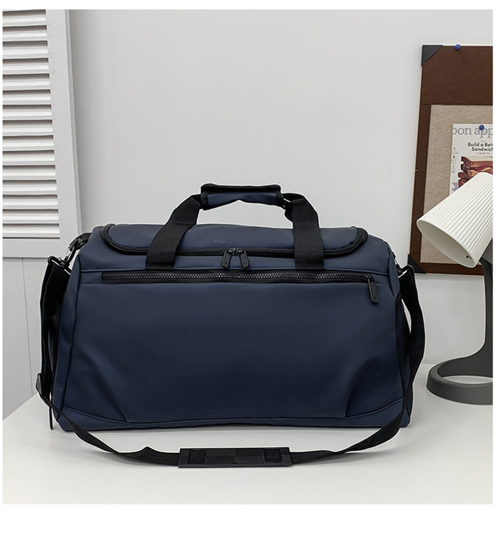 Sporty travel bag with reinforced carrying handles and multiple compartments Bowlift