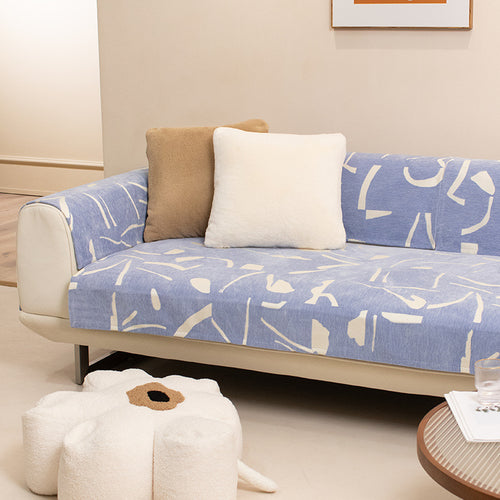 Removable sofa cover with abstract graphic print and elastic fitting edge