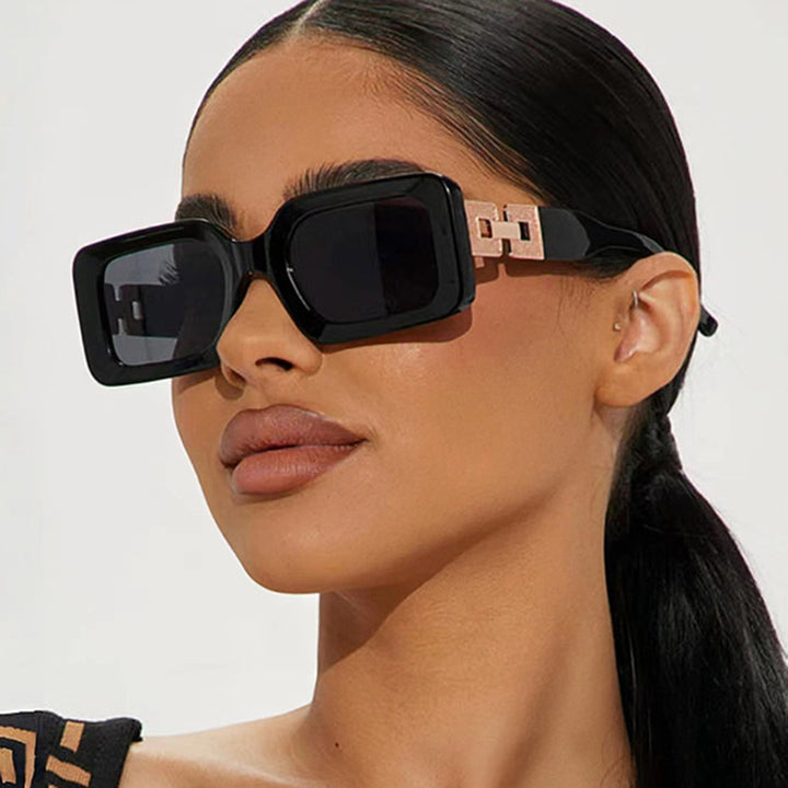 Women’s fashionable sunglasses in elegant square design with luxurious golden accents Bowlift