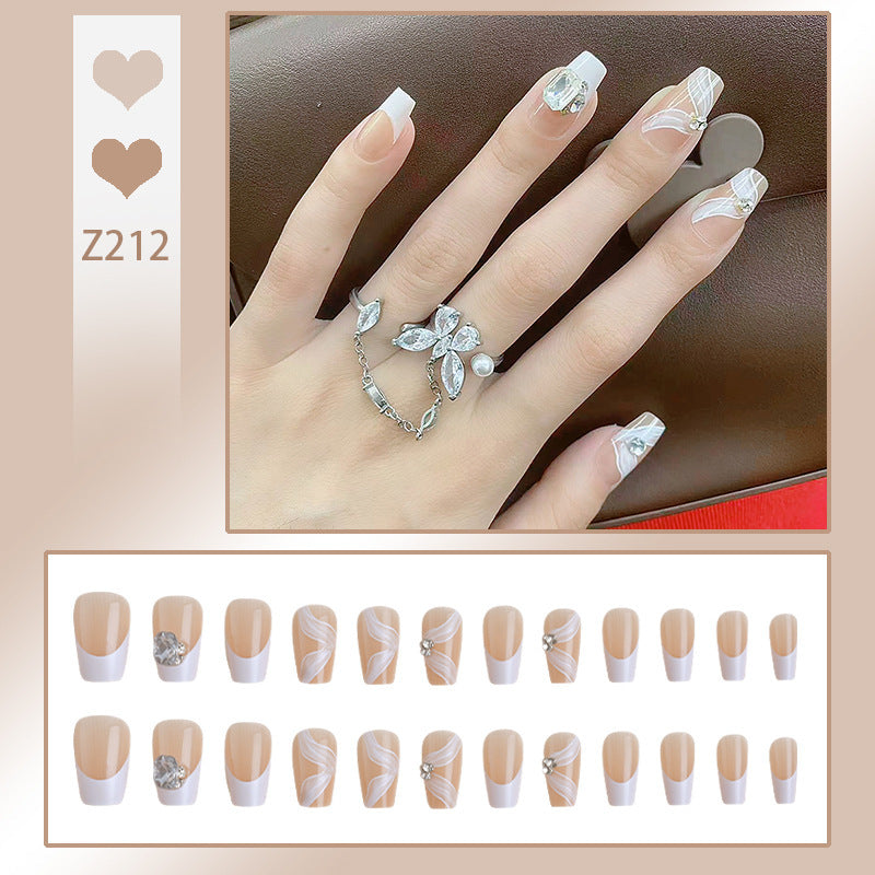 Elegant artificial nail set with delicate decorations and glitter elements Bowlift