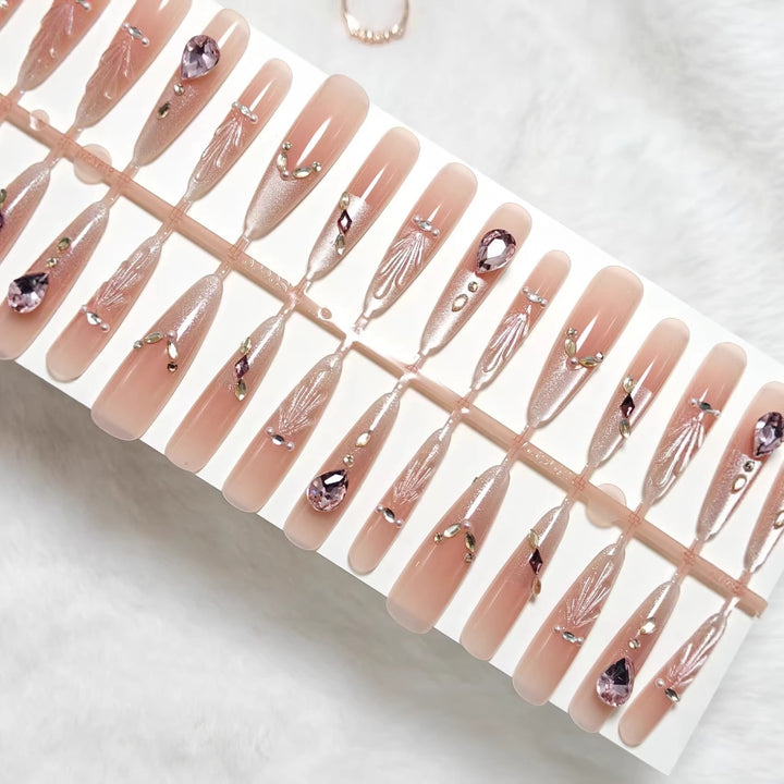 Artificial nails with glamorous crystal embellishments Bowlift