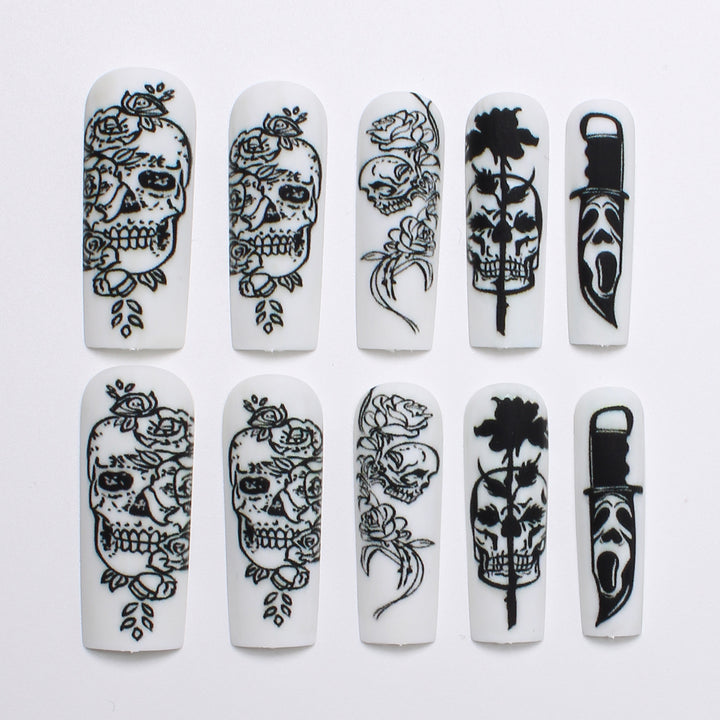 Nail set with spooky skull design and floral motifs Bowlift