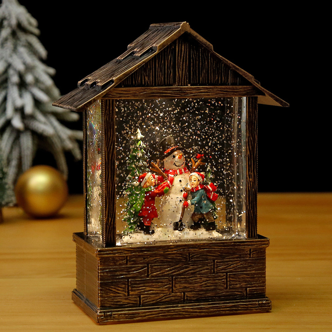 Nostalgic snow globe decoration with Santa Claus and children Bowlift