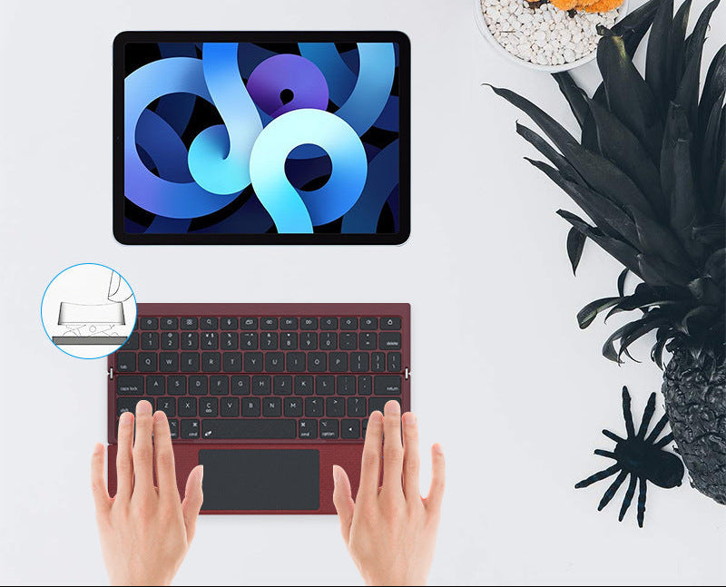 Compact Wireless Keyboard with Touchpad Bowlift