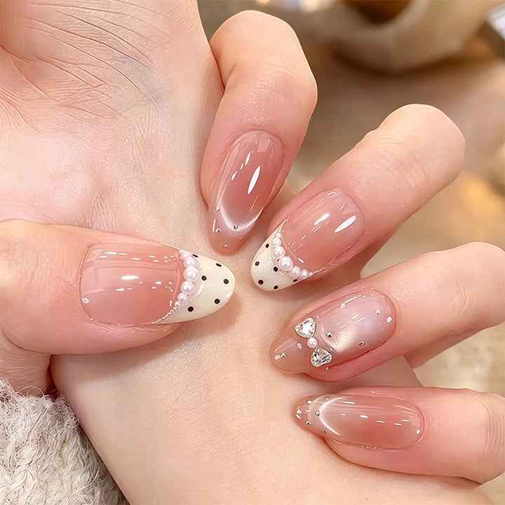 Artificial nail set with elegant French design and delicate pearl embellishments Bowlift