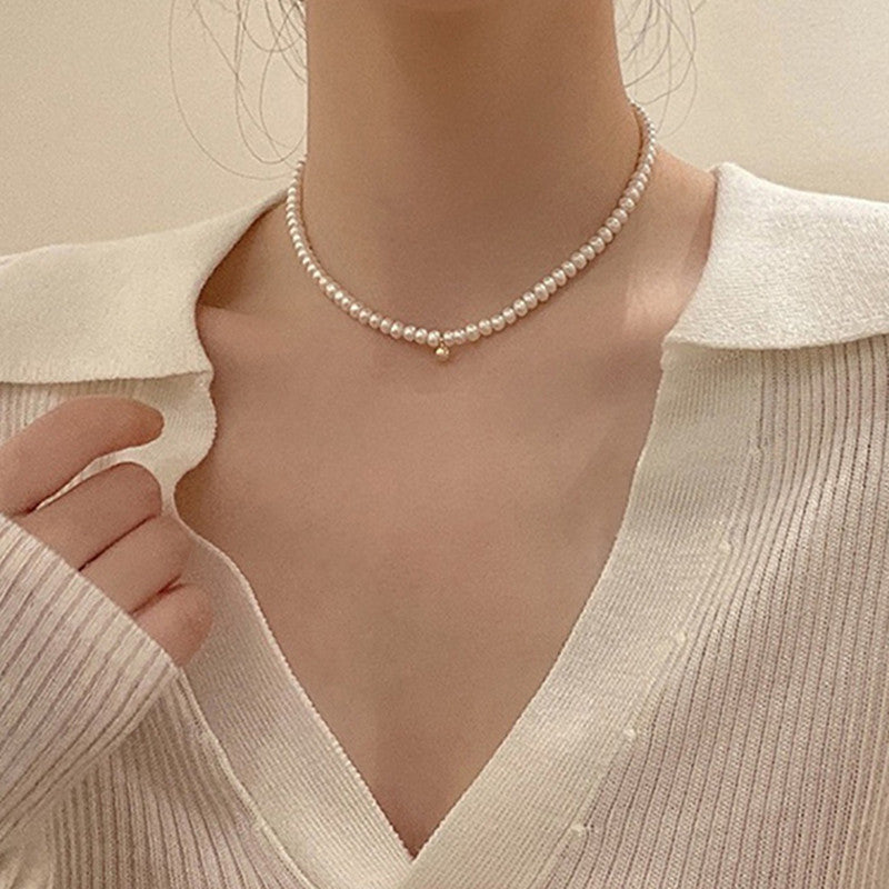 Delicate pearl necklace with elegant gold accent chain Bowlift