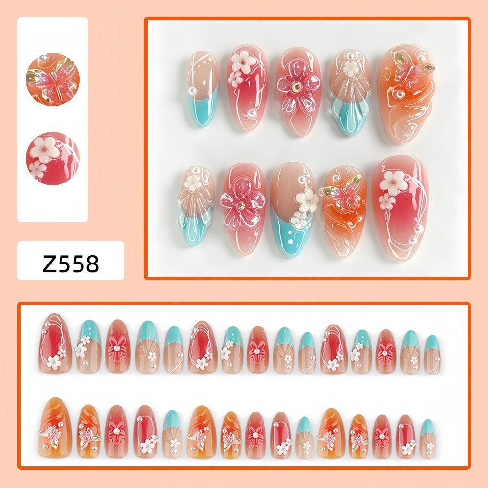 Artificial nail set with floral accents and glittering 3D applications Bowlift