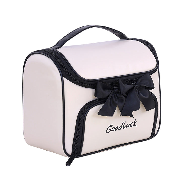 Cosmetic and toiletry bag with elegant bow accent Bowlift