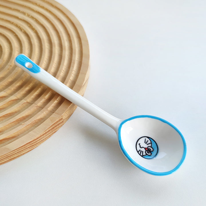 Ceramic soup spoon with lucky cat illustration and ergonomic long-handle Bowlift