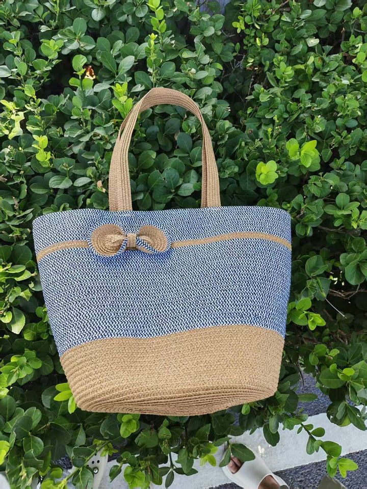 Elegant straw bag with decorative bow closure Bowlift