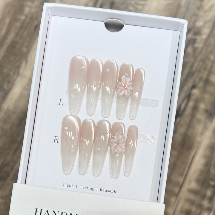 Elegant Stiletto Nail Extensions with Floral Accents Bowlift