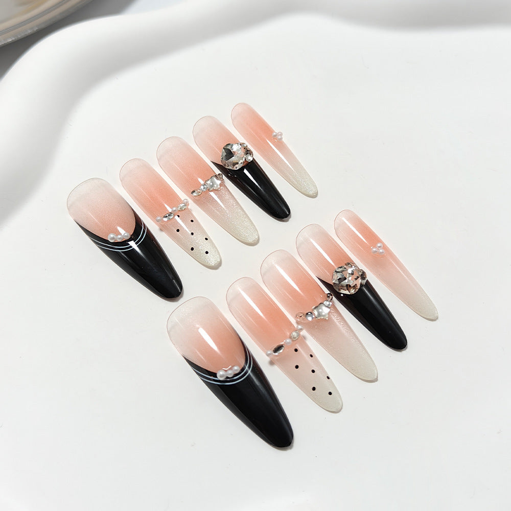 Artificial nails in elegant design with glittering decorations Bowlift
