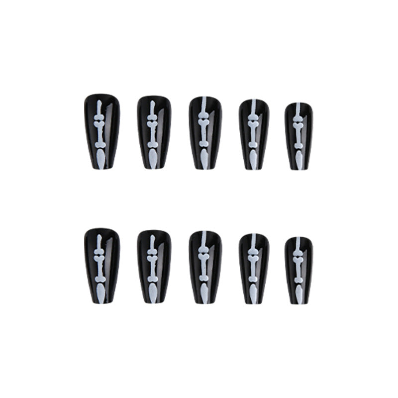 Artistic nail art with skull and bone motif Bowlift