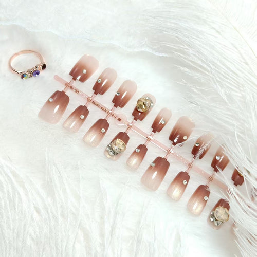 Artificials nails in elegant ombre style with rhinestone embellished applications Bowlift
