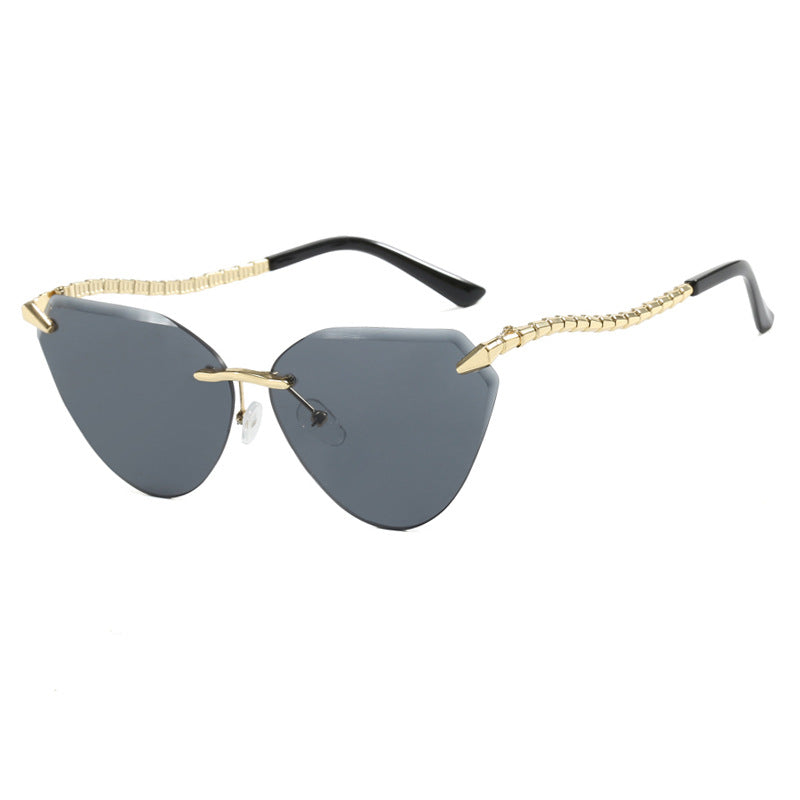 Women's Cat-Eye Sunglasses with unique gold frame design and protective lenses Bowlift
