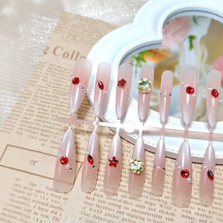 Glamorous artificial nails with shimmering embellishments Bowlift