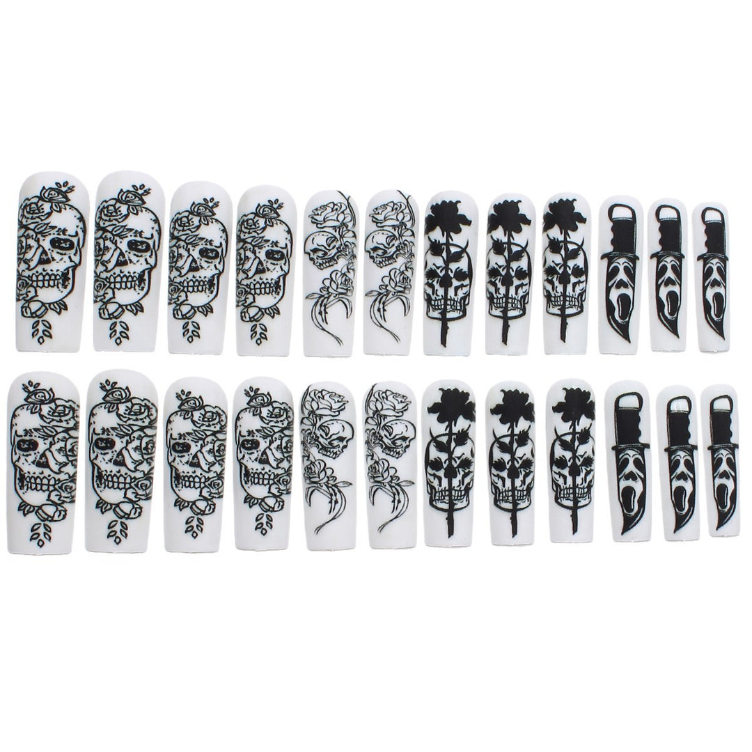 Nail set with spooky skull design and floral motifs Bowlift