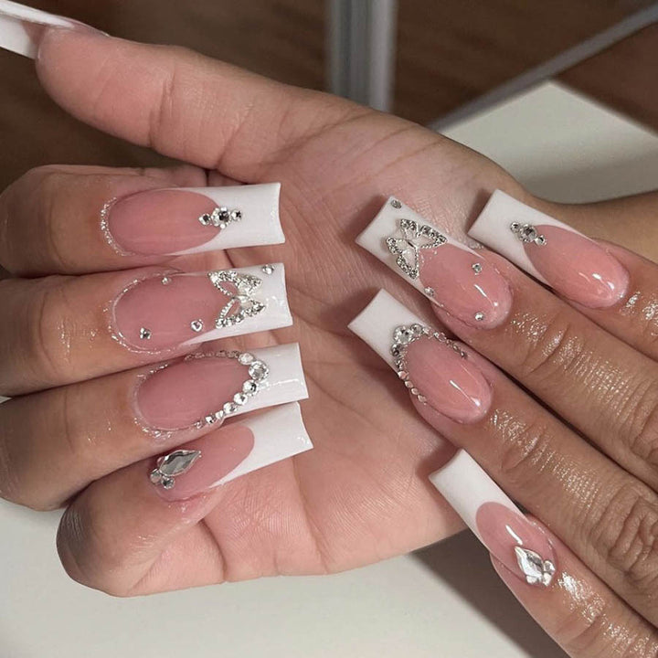 Acrylic nail set with elegant rhinestone and glitter decorations Bowlift