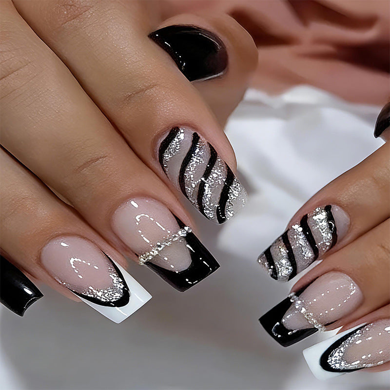 Elegant artificial nails with glitter and stripe accents Bowlift