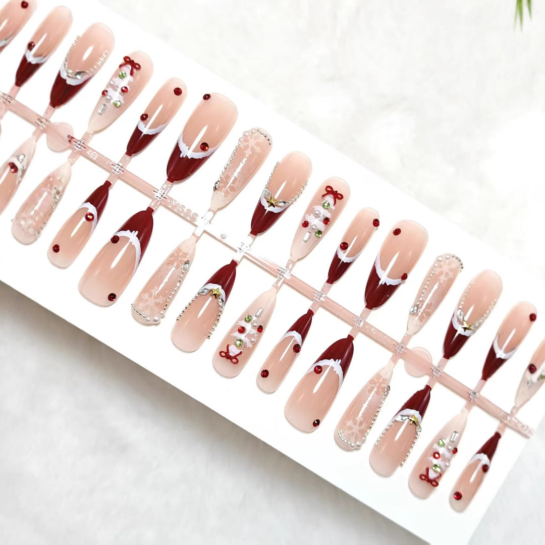Artificial nails with festive designs and glitter accents Bowlift