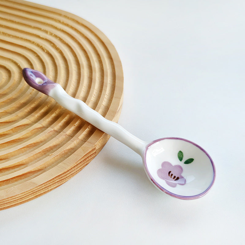 Ceramic soup spoon with lucky cat illustration and ergonomic long-handle Bowlift