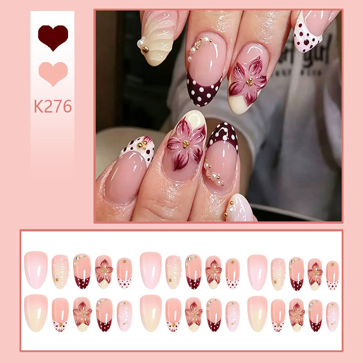 Elegant artificial nails set with floral accents Bowlift