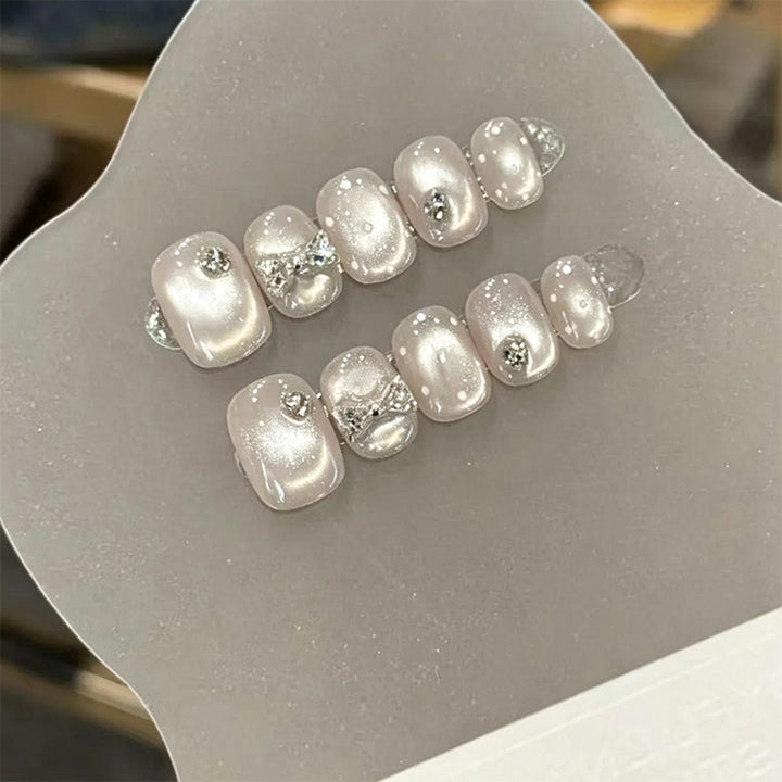 Artificial nail set with elegant glitter and crystal decorations Bowlift