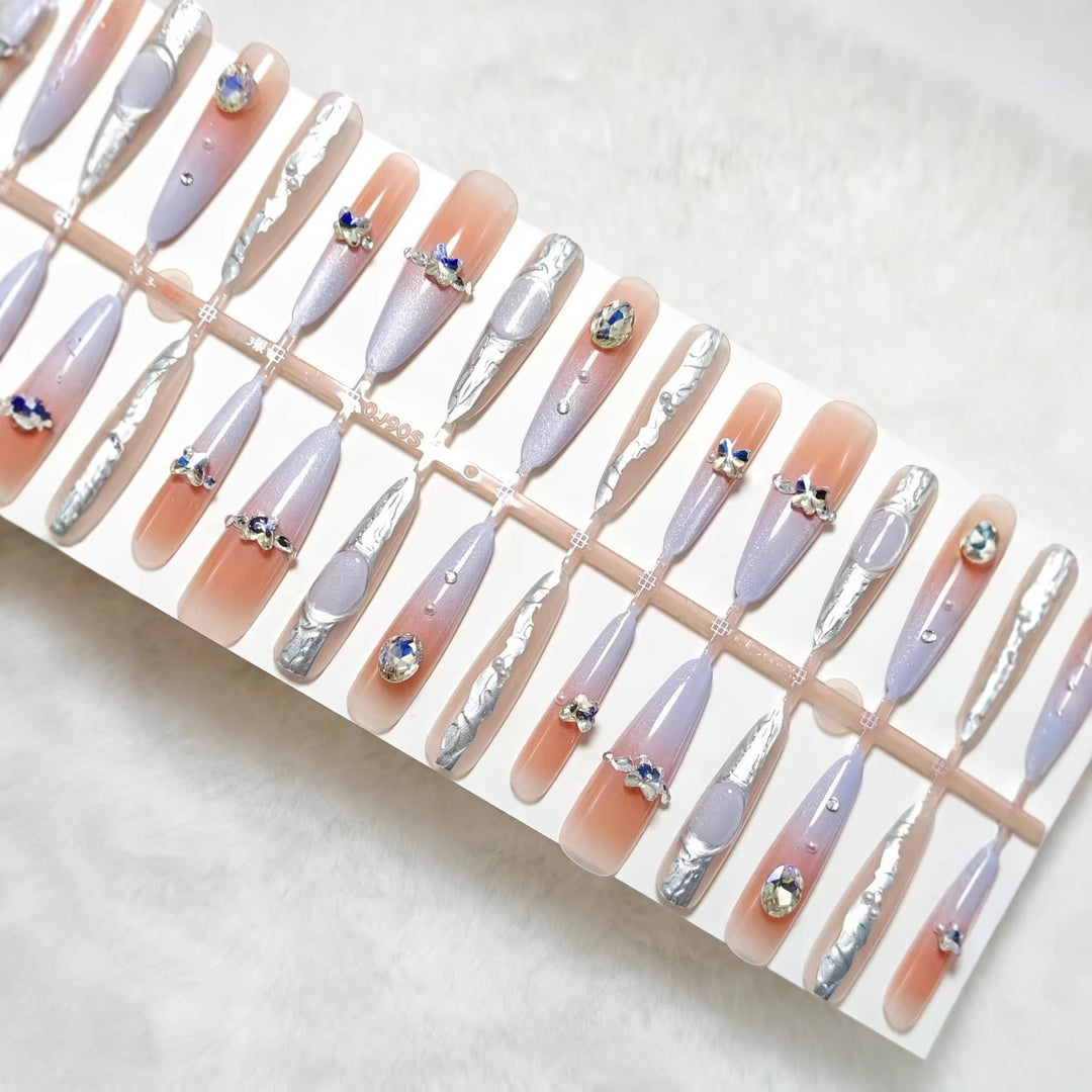 Artificial nails with elegant glitter and crystal accents Bowlift