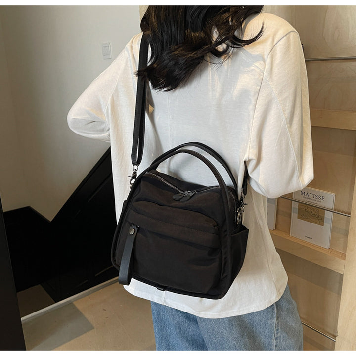 Fashionable shoulder bag with innovative structure and detachable carrying strap Bowlift